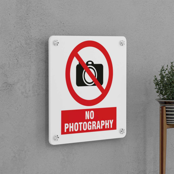 Why is taking photos strictly prohibited at customs?